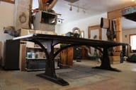 braced arch dining table in walnut
