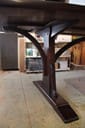 braced arch dining table in walnut